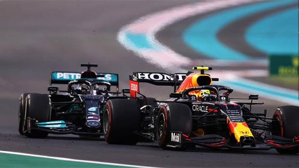 Two race cars going around track